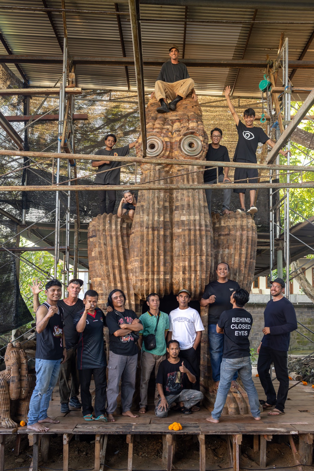 The full Bali and US Behind Closed Eyes crew posed across the build scaffold