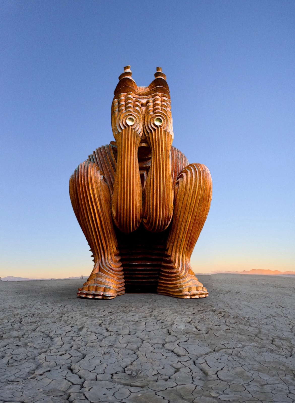 The Behind Closed Eyes sculpture sitting on the playa at sunset